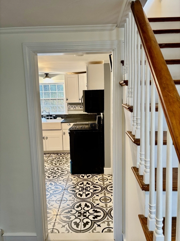 50 Colonial Road Hingham, MA 02043 - Photo 6 of 24 a kitchen with stainless steel appliances a refrigerator and a stove top oven