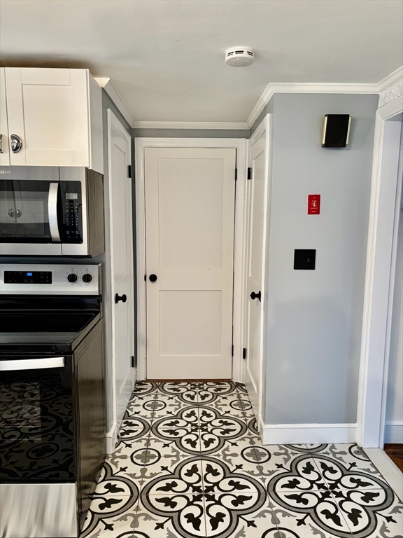 50 Colonial Road Hingham, MA 02043 - Photo 9 of 24 a kitchen with stainless steel appliances a refrigerator and a stove