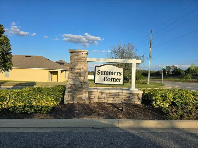 a view of a street with a building in the background
