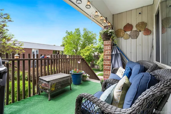 a view of balcony with furniture