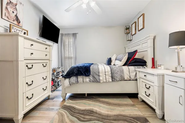 a living room with furniture and a flat tv screen