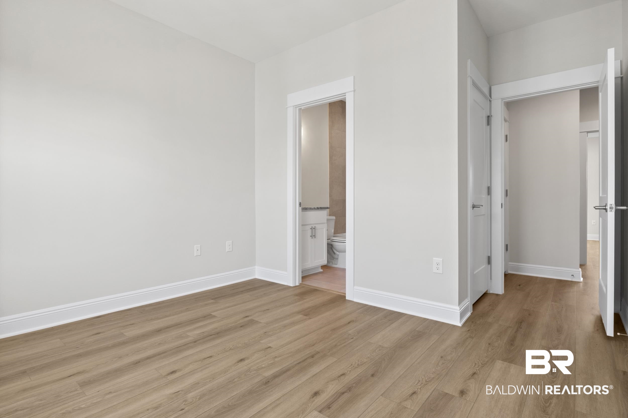 2847 Salt Drive Orange Beach, AL 36561 - Photo 19 of 29 Unfurnished bedroom with light hardwood / wood-style floors and ensuite bath