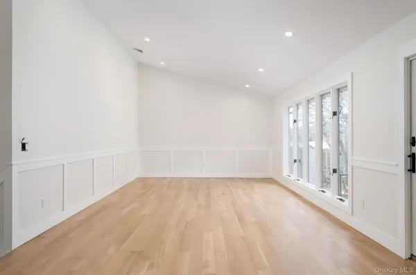 a view of hallway with wooden floor
