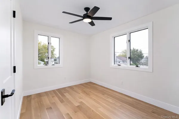 a view of an entryway with wooden floor