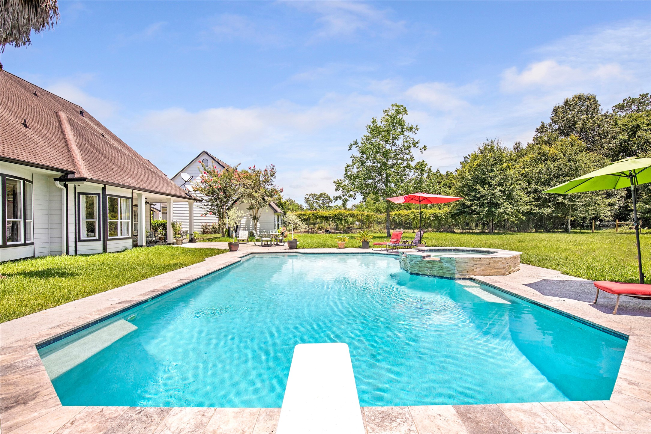 6530 Treaschwig Road, Unit 1 Spring, TX 77373 - Photo 27 of 32 a view of a swimming pool with an outdoor space and seating area