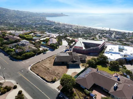an aerial view of a house with a big yard
