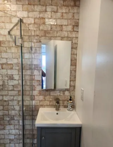 a bathroom with a sink and a mirror