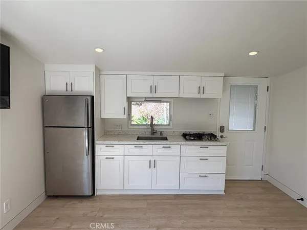 a view of kitchen and wooden floor