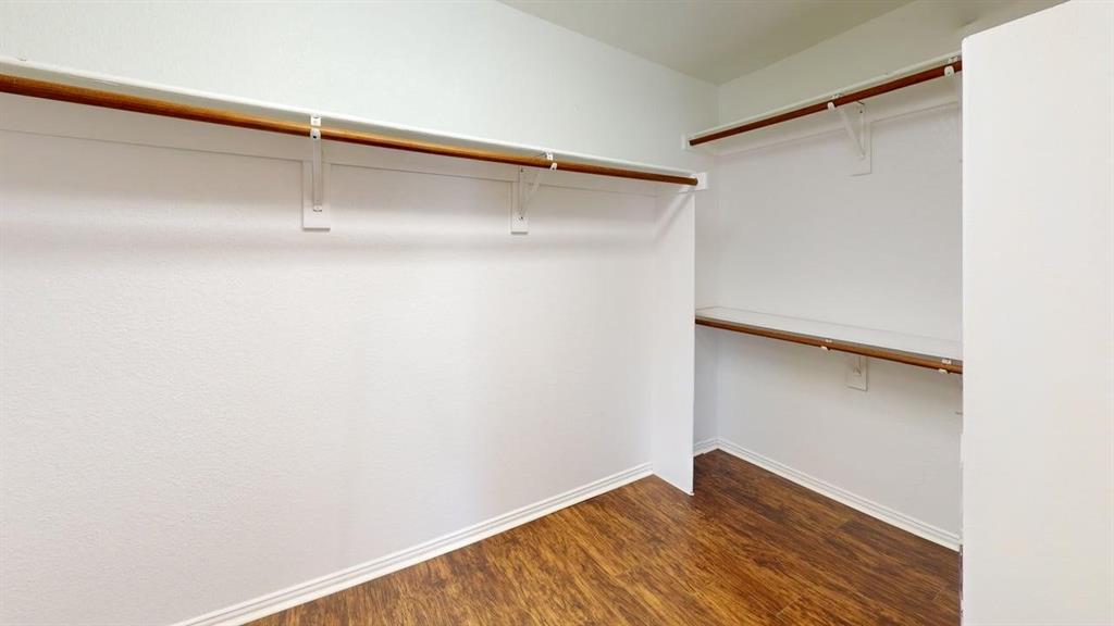 3223 Winding Ridge Circle Arlington, TX 76063 - Photo 23 of 27 Walk in closet featuring dark wood-style floors
