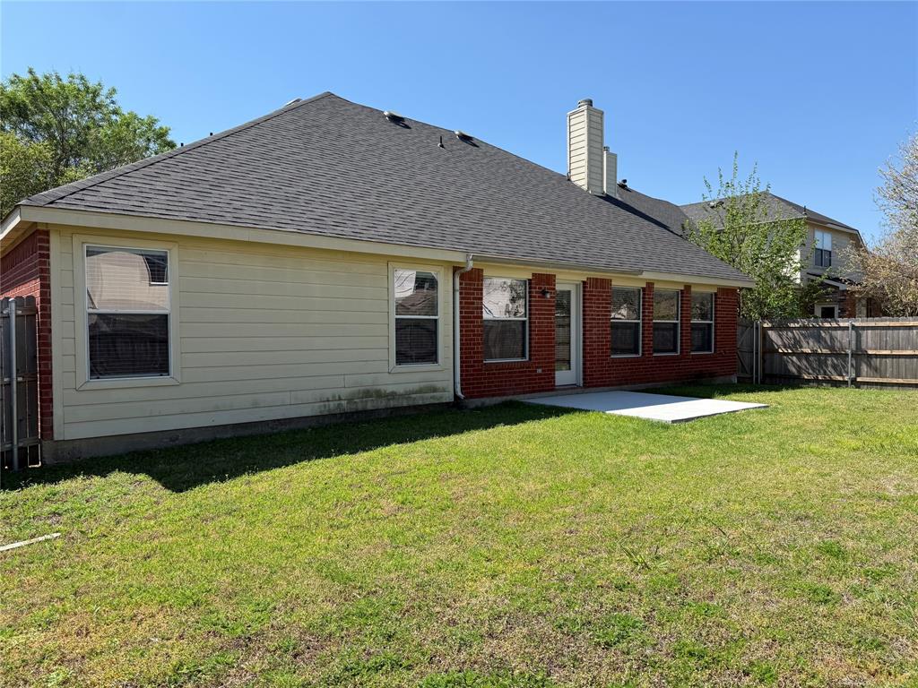 3223 Winding Ridge Circle Arlington, TX 76063 - Photo 25 of 27 Rear view of property with a fenced backyard, a shingled roof, a patio, brick siding, and a chimney
