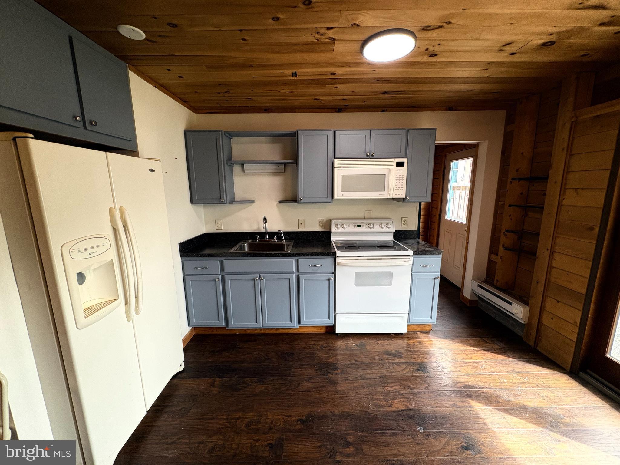 1400 Core Road Romney, WV 26757 - Photo 56 of 73 a kitchen with stainless steel appliances a refrigerator and a stove