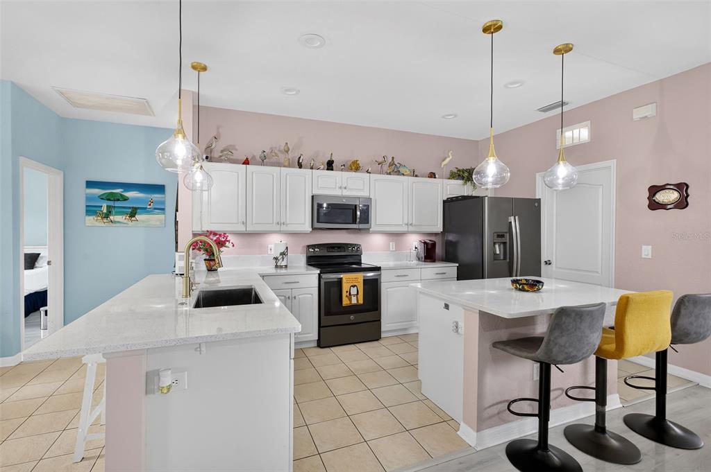 145 Brig Circle East Placida, FL 33946 - Photo 17 of 44 a kitchen that has a table chairs and a refrigerator