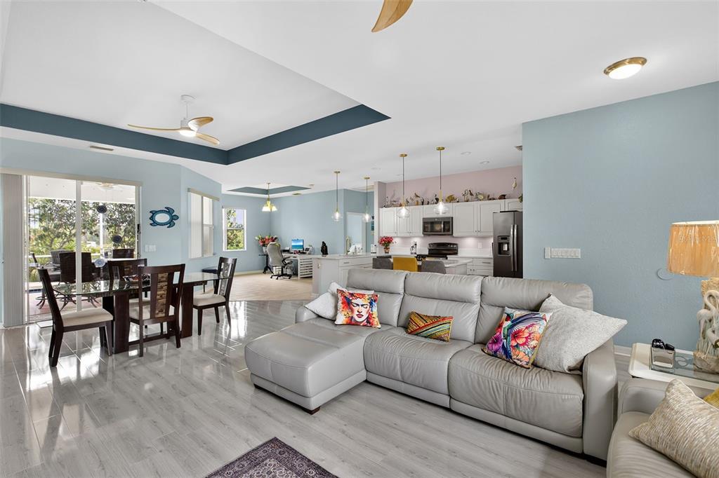 145 Brig Circle East Placida, FL 33946 - Photo 23 of 44 a living room with furniture and a dining table with wooden floor