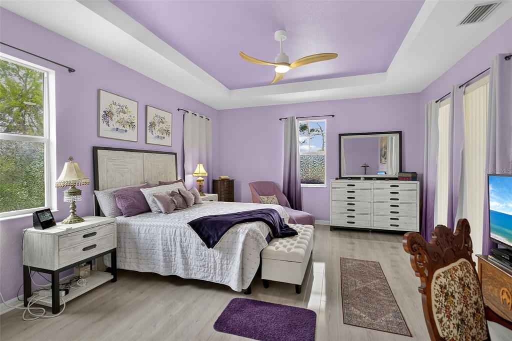 145 Brig Circle East Placida, FL 33946 - Photo 25 of 44 a bedroom with a bed and wooden floor