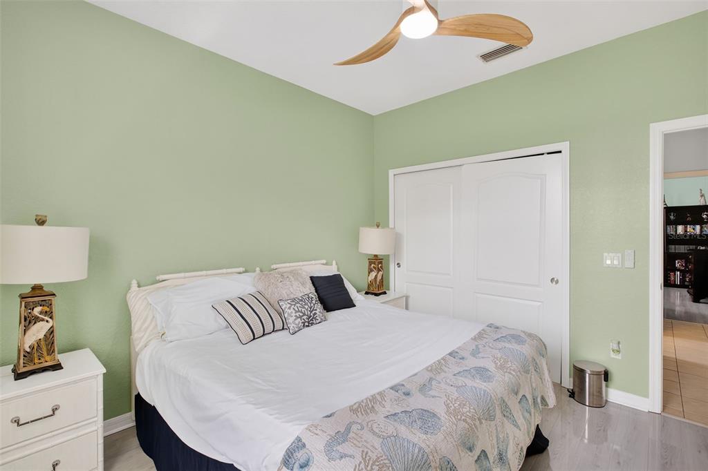 145 Brig Circle East Placida, FL 33946 - Photo 34 of 44 a bedroom with a bed and a lamp