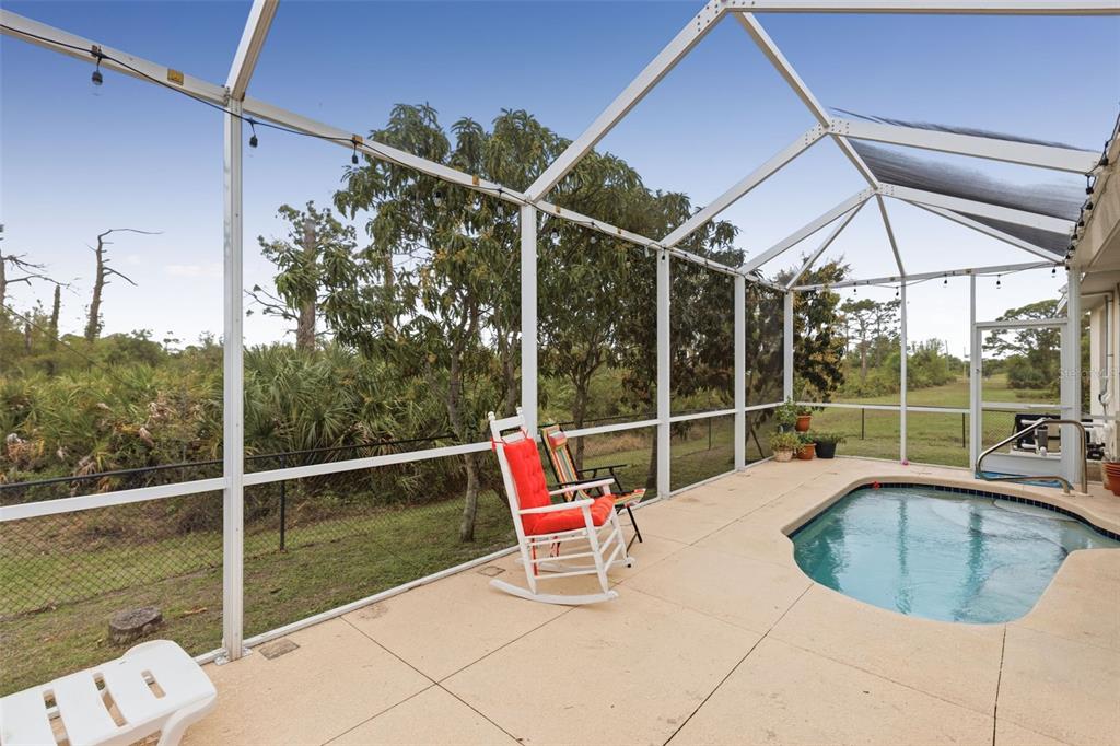 145 Brig Circle East Placida, FL 33946 - Photo 37 of 44 a view of a roof deck with couches and wooden floor