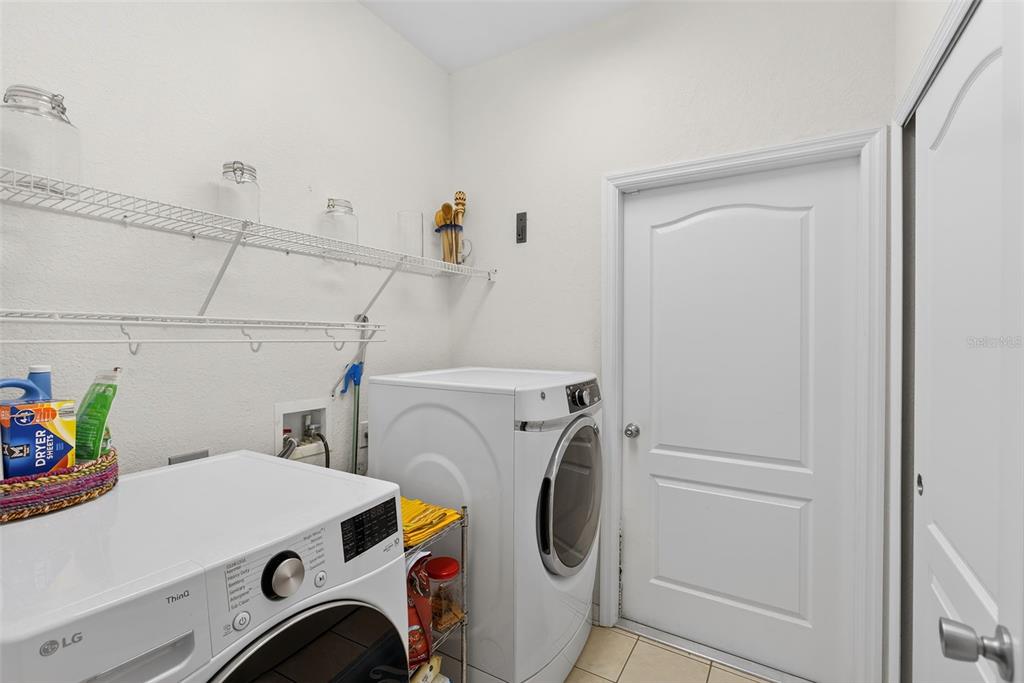 145 Brig Circle East Placida, FL 33946 - Photo 42 of 44 a utility room with dryer and washer