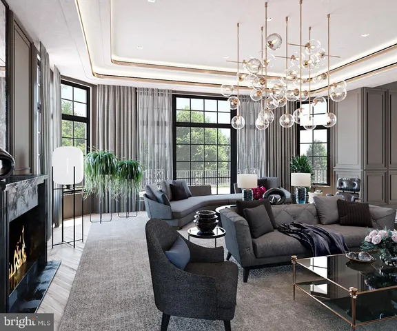 a living room with furniture a chandelier and a fireplace