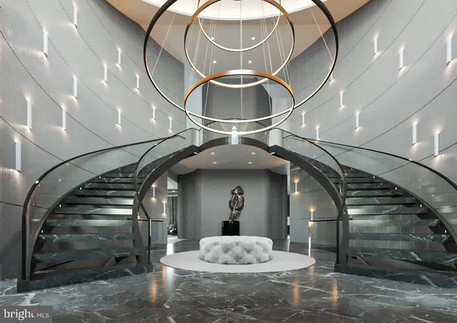 a view of staircase with a sink and chandelier