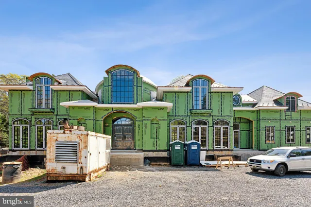 a front view of a house with parking space