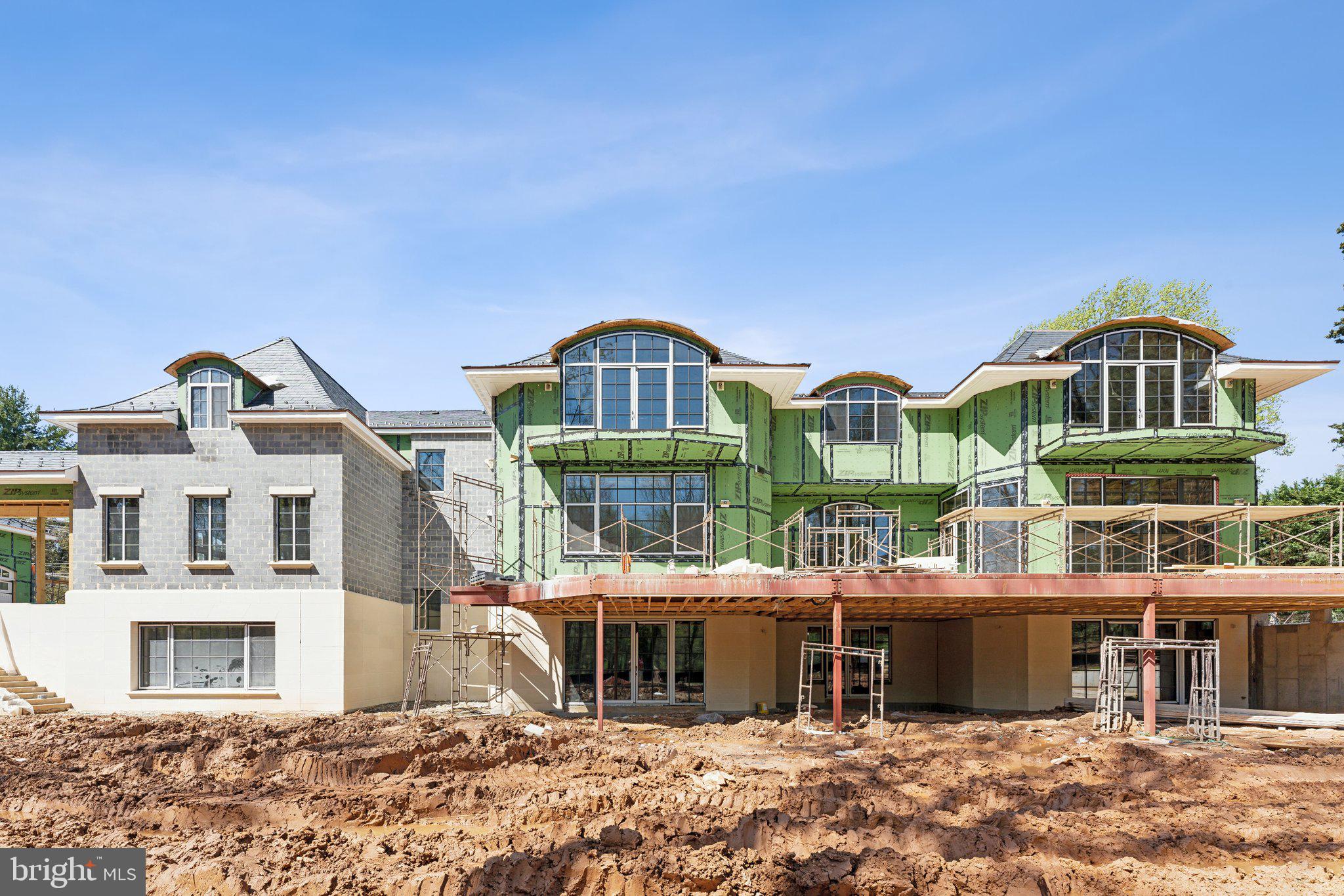 1171 Chain Bridge Road McLean, VA 22101 - Photo 40 of 44 a front view of a residential apartment building with a yard