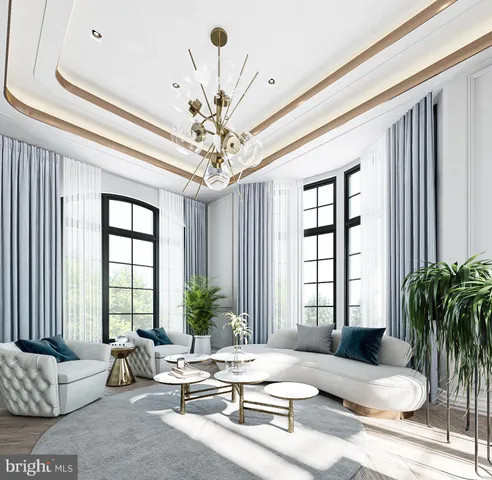 a living room with furniture and a chandelier