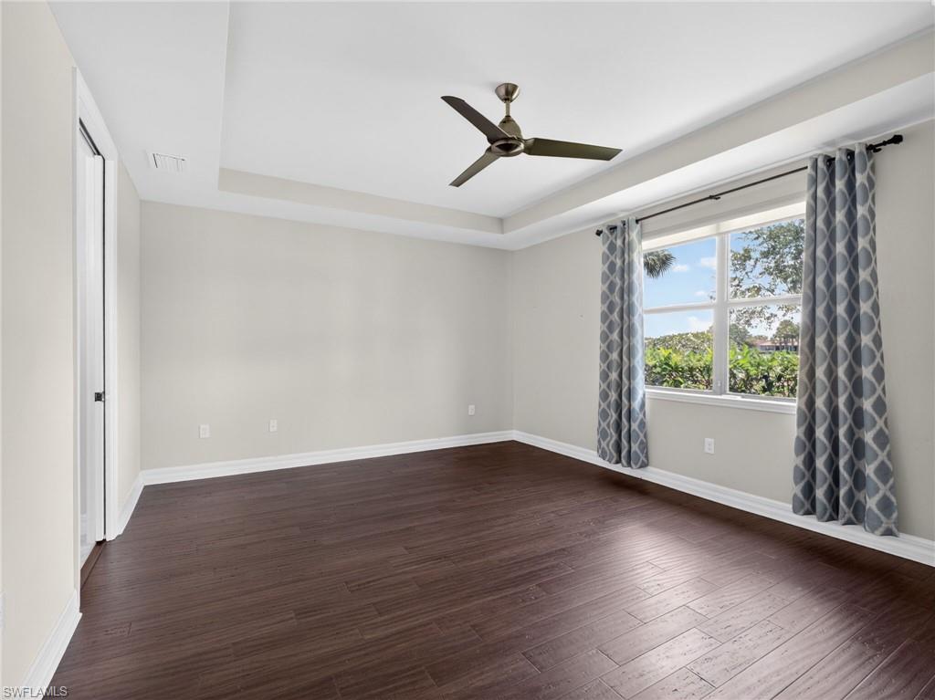 6124 Victory Drive Ave Maria, FL 34142 - Photo 26 of 50 a view of an empty room with wooden floor and a window