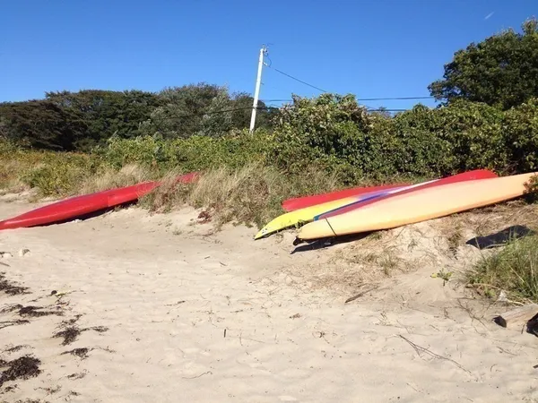 a room with lots of wooden furniture and a window