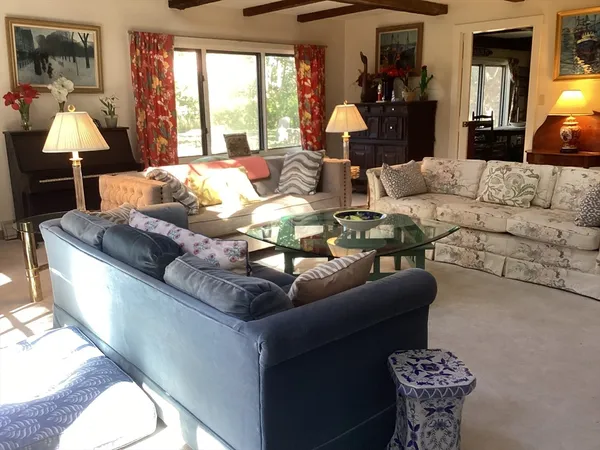 a bedroom with a bed and a television