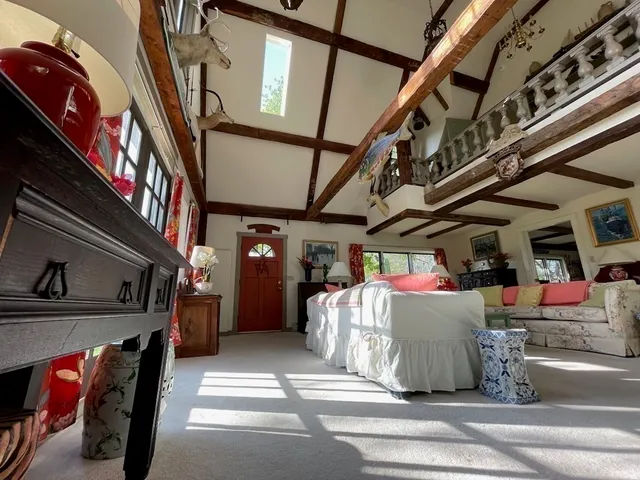 a bedroom with furniture and a window