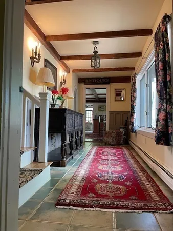 a spacious bedroom with a bed and window