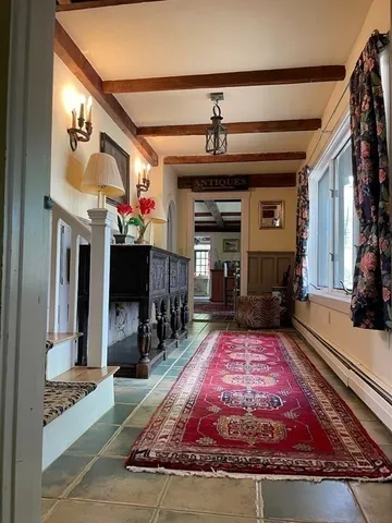a spacious bedroom with a bed and window