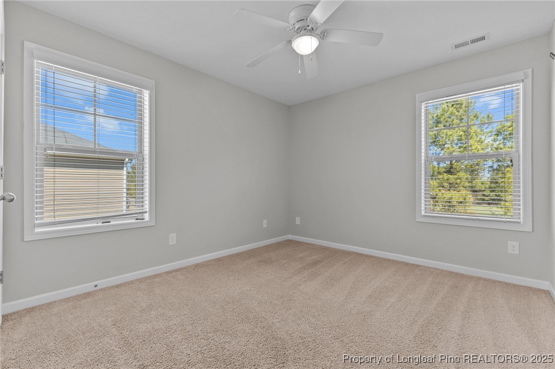 251 Crane Way Bunnlevel, NC 28323 - Photo 12 of 49 an empty room with a window