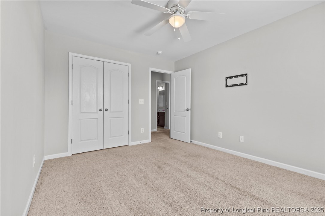 251 Crane Way Bunnlevel, NC 28323 - Photo 15 of 49 a view of an empty room with a chandelier fan