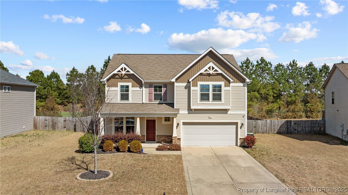 251 Crane Way Bunnlevel, NC 28323 - Photo 2 of 49 a front view of a house with garden and parking