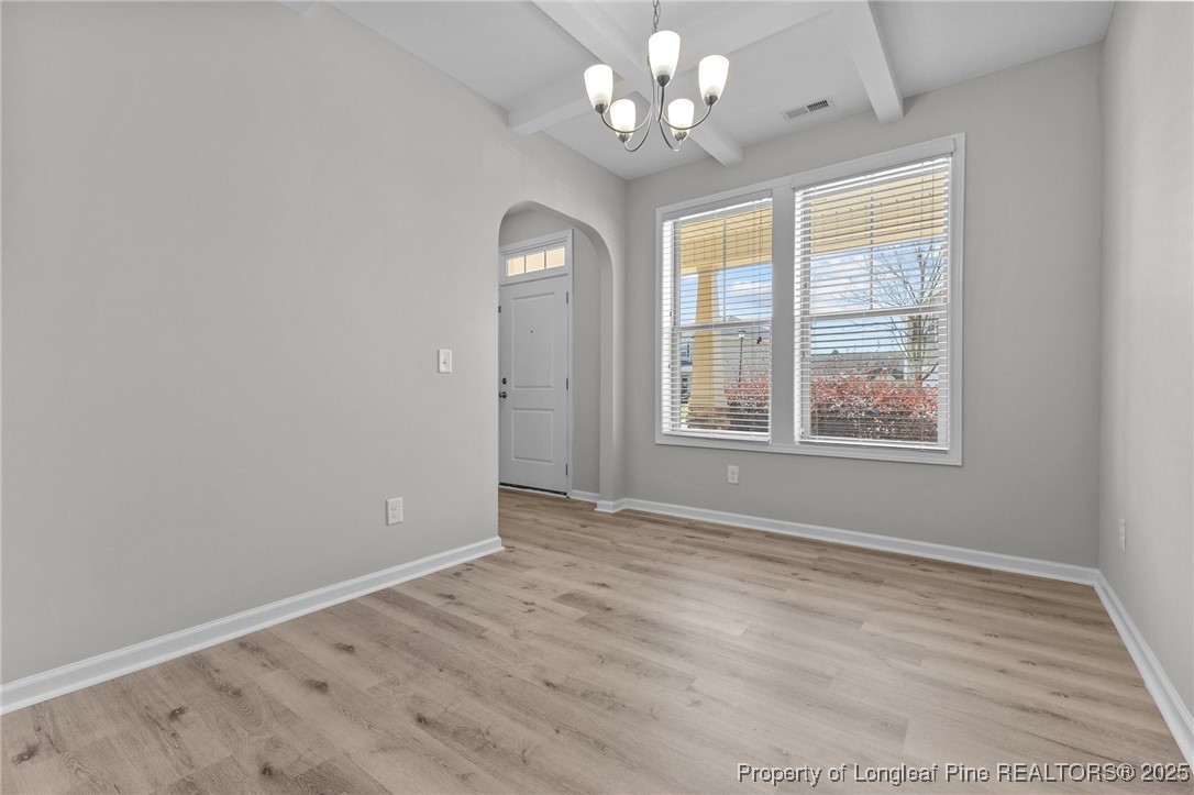 251 Crane Way Bunnlevel, NC 28323 - Photo 29 of 49 an empty room with wooden floor and windows