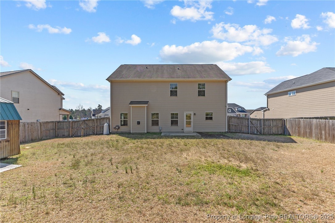 251 Crane Way Bunnlevel, NC 28323 - Photo 36 of 49 a view of a house with a wooden fence