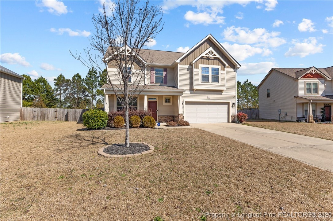 251 Crane Way Bunnlevel, NC 28323 - Photo 43 of 49 a front view of a house with a yard and garage