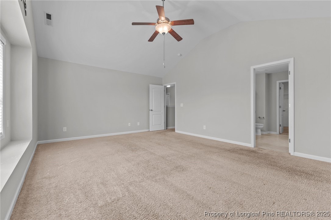 251 Crane Way Bunnlevel, NC 28323 - Photo 5 of 49 a view of a room with a ceiling fan and a window