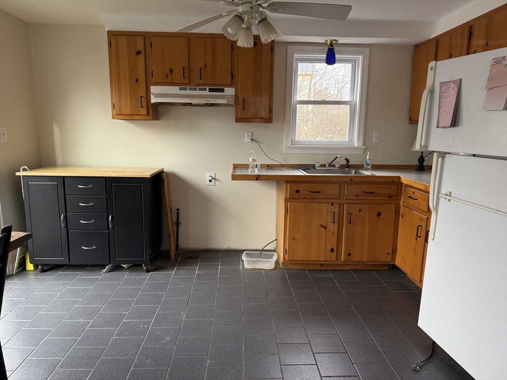 6 Anthony Road Tewksbury, MA 01876 - Photo 14 of 31 a kitchen with stainless steel appliances granite countertop a refrigerator and a stove