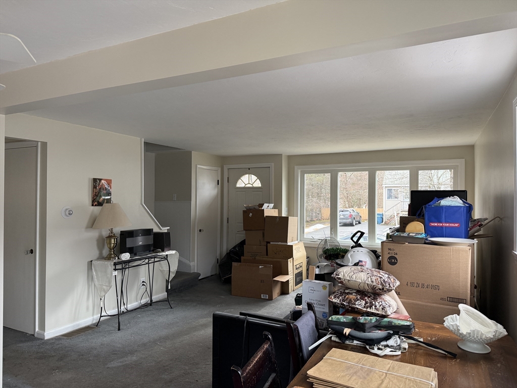 6 Anthony Road Tewksbury, MA 01876 - Photo 17 of 31 a living room with furniture and a large window