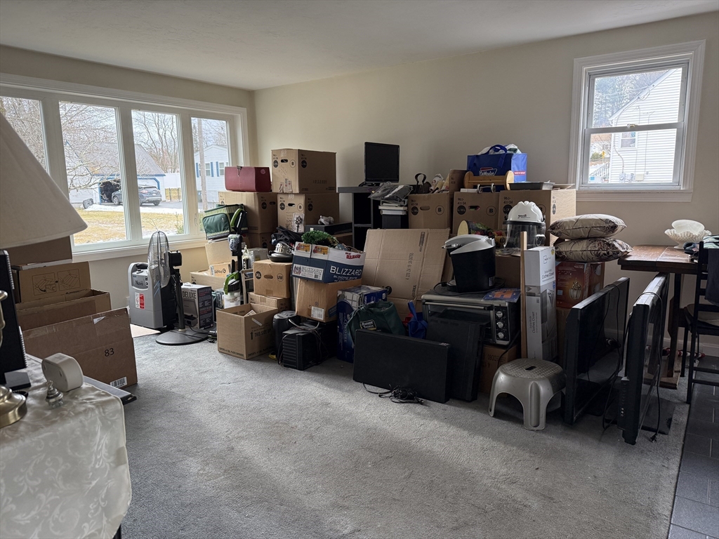 6 Anthony Road Tewksbury, MA 01876 - Photo 19 of 31 a room with lots of furniture and windows