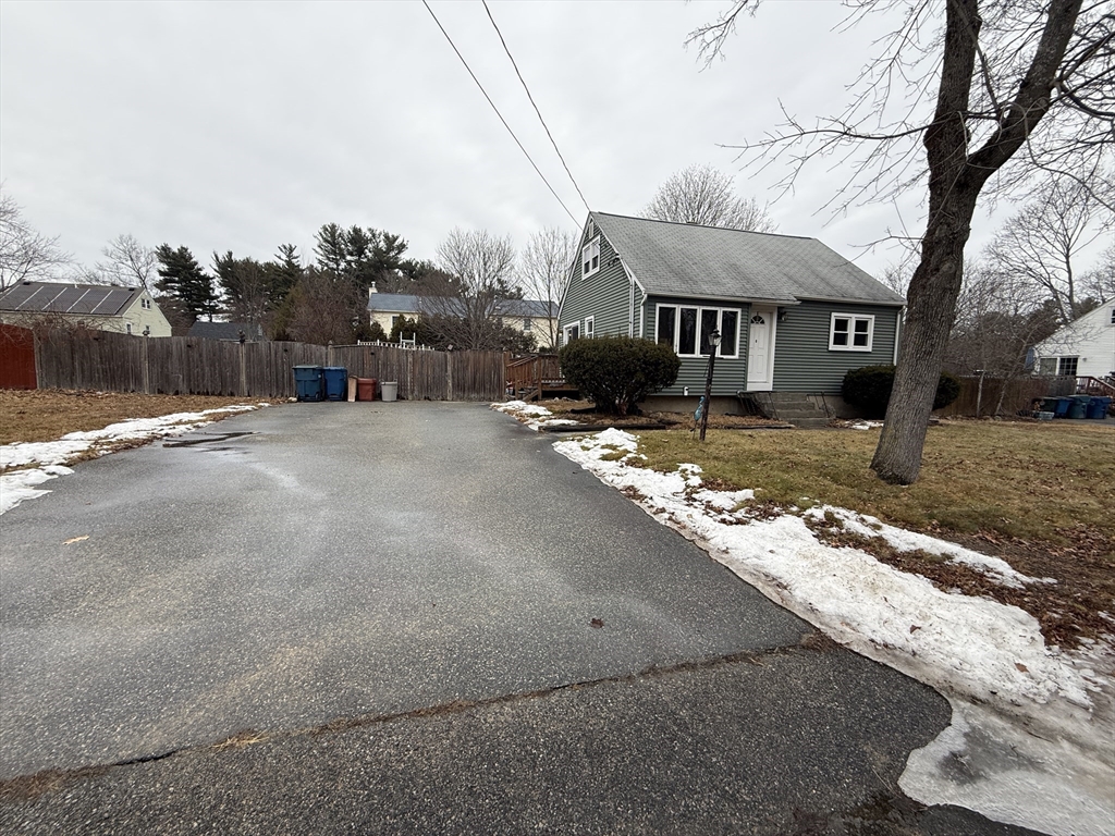 6 Anthony Road Tewksbury, MA 01876 - Photo 9 of 31 a view of a house with snow on the road