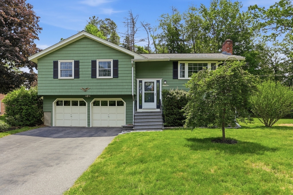 33 Simon Willard Road Acton, MA 01720 - Photo 32 of 42 a front view of a house with a yard and trees