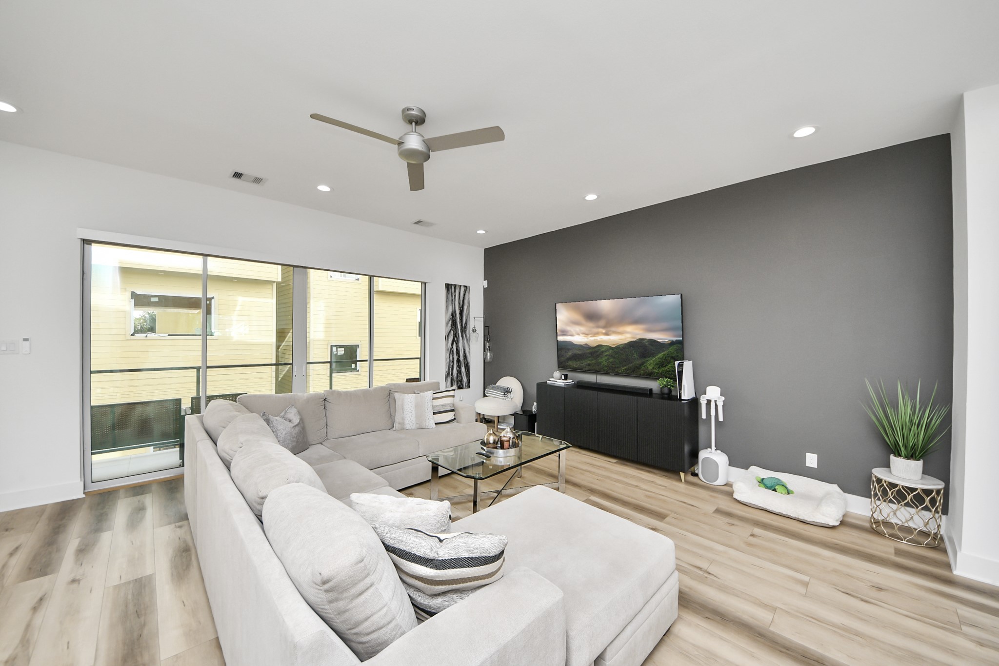 1044 West 17th Street Houston, TX 77008 - Photo 14 of 48 a living room with furniture floor to ceiling window and wooden floor