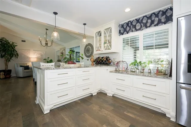 a room with a dresser and a window