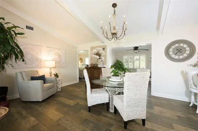 a view of a livingroom with furniture and a chandelier