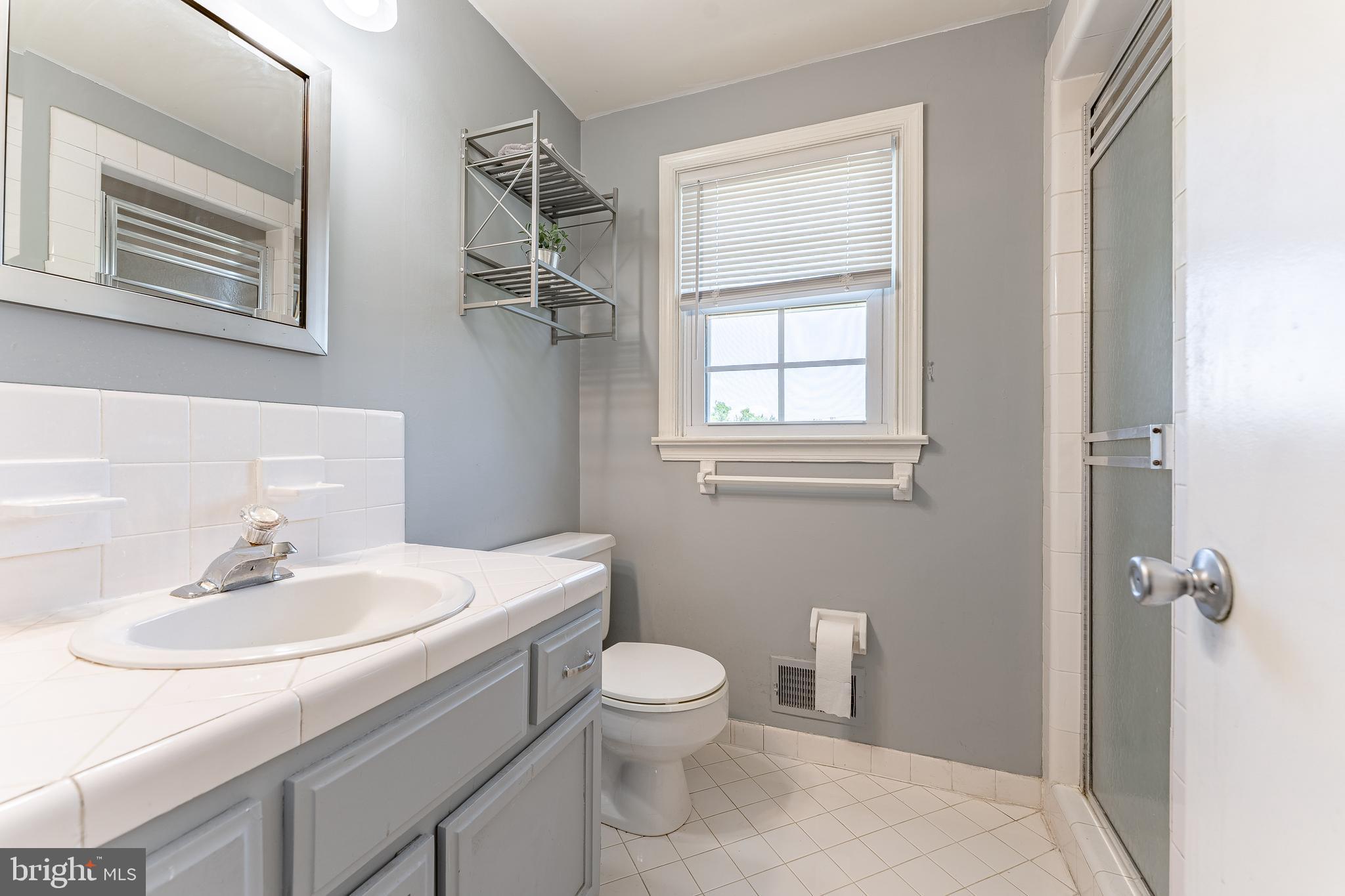 84 North Spring Lane Phoenixville, PA 19460 - Photo 30 of 51 a bathroom with a sink toilet and a mirror