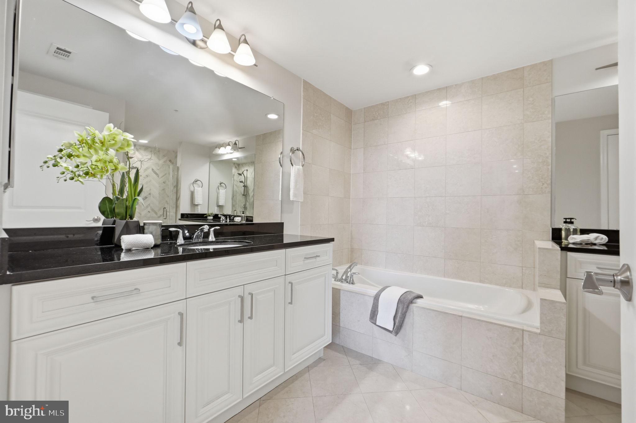 11990 Market Street, Unit 2103 Reston, VA 20190 - Photo 46 of 78 Elegant bathroom with modern finishes.
