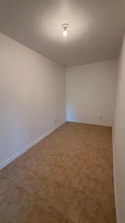 an empty room with a bench